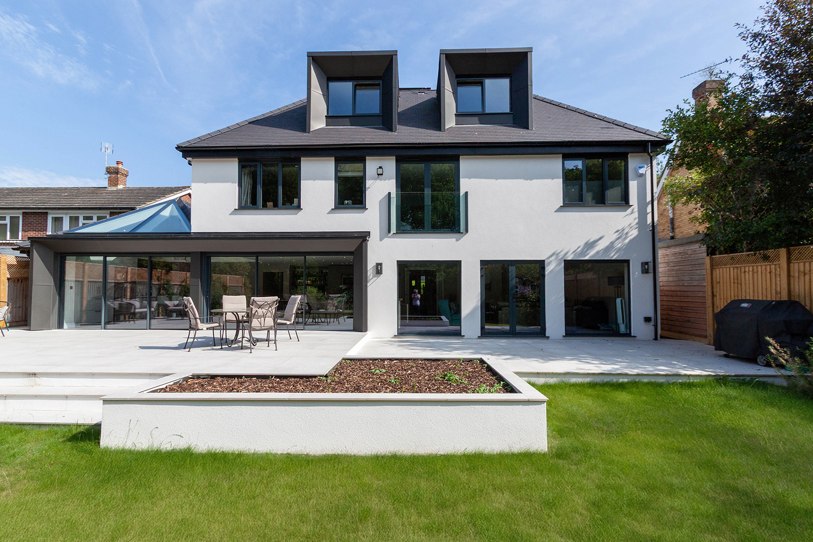Loft extension with triangular rooflight and lightweight roof structure