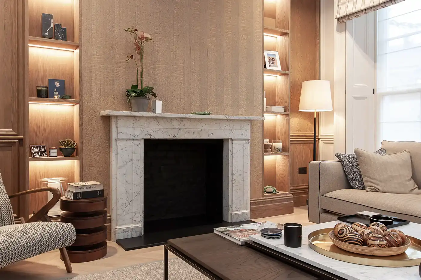 Minimal living room with refined materials and architectural detailing London townhouse
